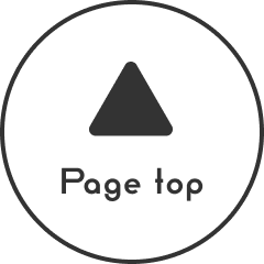 丸の中に黒い三角形があるボタン